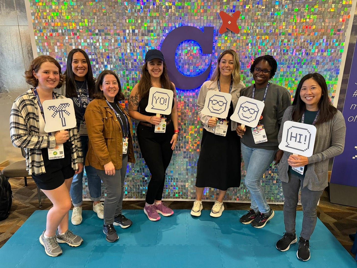 a group of girls on an image background at the coalesce conference. 